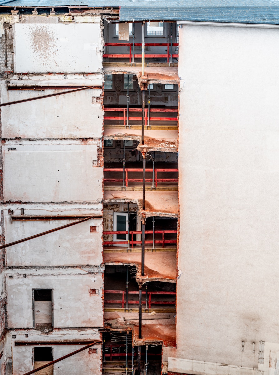 A tall white building with lots of windows